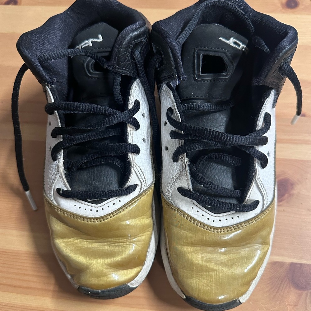 Kids Black and Gold Sneakers use